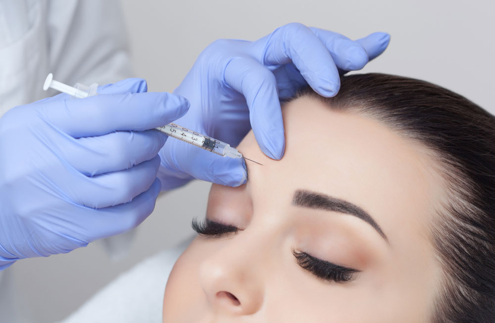 A women getting an injection on her face