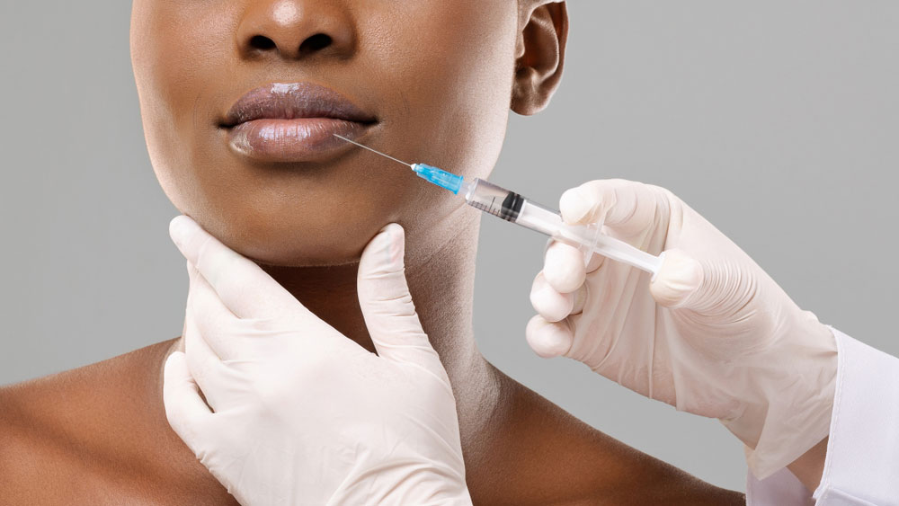 A women getting an injection on her face
