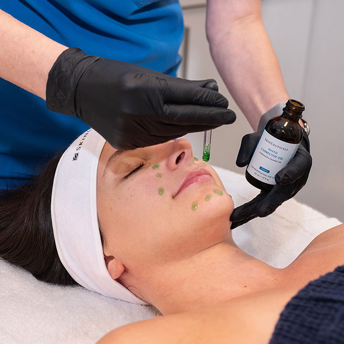 woman receiving facial gel treatment