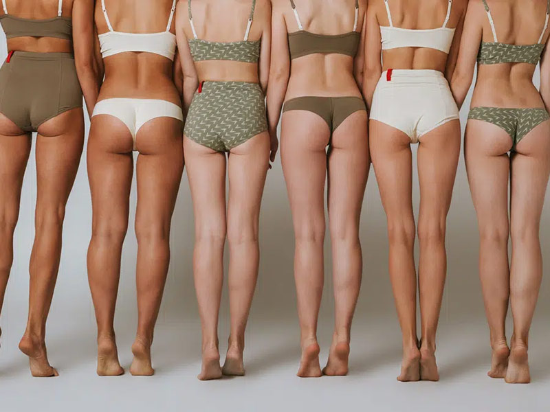 a group of woman posing in front of camera