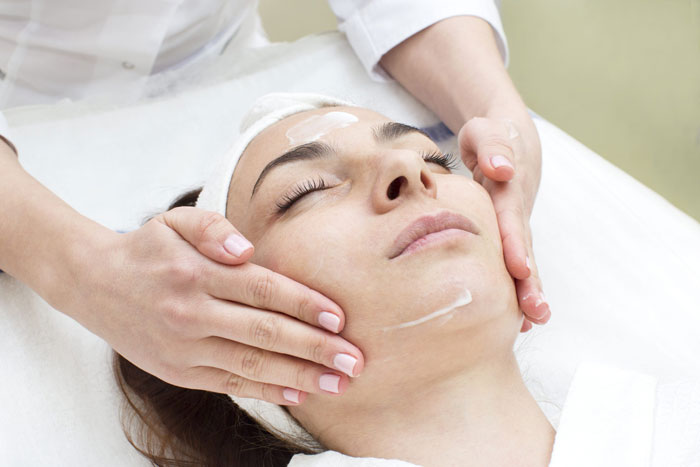 woman receiving facial treatment